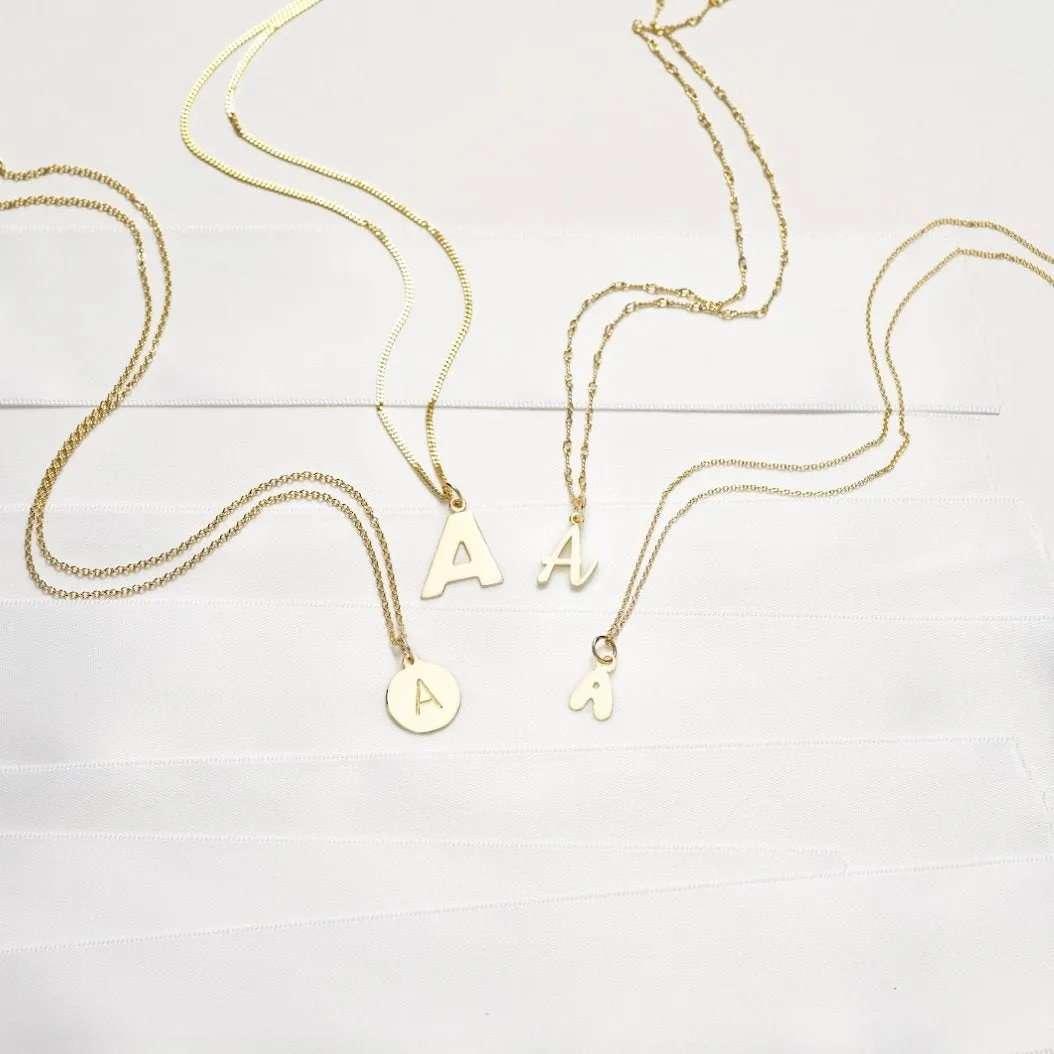 "Q" Cutout Letter Charm